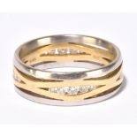 VAN DAM LTD FOR BOODLES; an 18ct white and yellow gold diamond set ring of open design, the