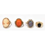 Four 9ct yellow gold rings comprising an oval carnelian set ring with carved profile of a Roman