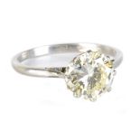 A platinum and diamond solitaire ring, the round brilliant cut stone weighing approx 1.75cts in