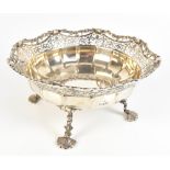 ADIE BROTHERS; a large George V hallmarked silver bowl with shaped pierced rim and raised on four