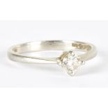 A platinum and diamond solitaire ring, the round brilliant cut stone weighing approx 0.33ct in