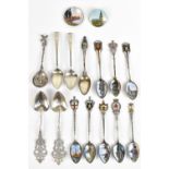 A group of Continental silver to include eight town spoons with enamel decorated bowls and crests, a