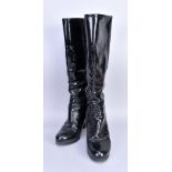 PRADA; a pair of black patent leather boots, heel 3.5 inches (size 38).Additional InformationThere