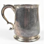 JAMES STONE (PROBABLY); a George II hallmarked silver mug with double scroll handle and spreading