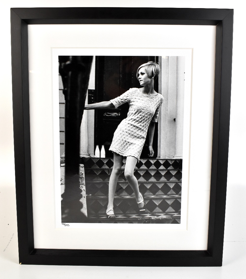 An iconic black and white limited edition photographic print of Twiggy with blind stamp for the