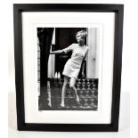 An iconic black and white limited edition photographic print of Twiggy with blind stamp for the