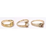 Three 9ct yellow gold dress rings including white stone set example with chased detail to the