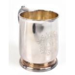 WILLIAM LUKIN; a George II hallmarked silver mug with simple scroll handle, spreading circular