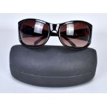 BRUCE OLDFIELD; a pair of brown tortoiseshell lady's sunglasses (in original case).Additional