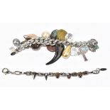 MAWI; a silver tone heavy link charm bracelet with numerous charms including a hallmarked silver