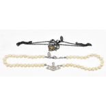 VIVIENNE WESTWOOD; a one-row pearl choker with iconic logo and a Vivienne Westwood black metal chain