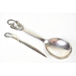 D G S; a Danish white metal spoon with pierced cast detail, length 21.5cm, together with a 925