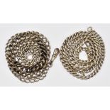 A hallmarked silver long graduated pocket watch chain, length 71cm, and a further chain comprising