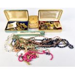 A selection of assorted costume jewellery including beads, brooches, etc.Additional