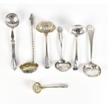 A group of variously hallmarked silver sifting spoons including an apostle top example by John