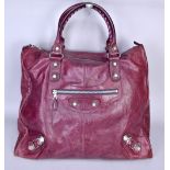 BALENCIAGA; a large maroon red leather city bag with silver tone hardware, 50 x 45 x 21cm.Additional