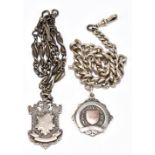 A graduated hallmarked silver watch chain with spring end clip, T-bar and fob with vacant shield,