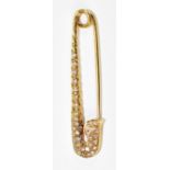 An 18ct yellow gold diamond set novelty brooch in the form of a safety pin, the frame set with