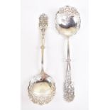 JAMES DIXON & SONS; a pair of Edwardian hallmarked silver spoons with elaborate pierced decoration