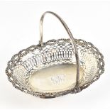 PHILIP FREEMAN; a George III hallmarked silver swing handled basket of pierced oval form with