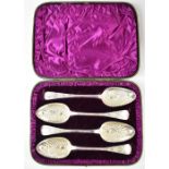 WILLIAM ELEY & WILLIAM FEARN; a cased set of four George III hallmarked silver berry spoons with