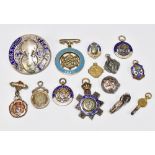 A group of silver fobs, many with enamel decoration including West Lancashire Charity Jewel, 1809