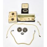 A group of faux pearl necklaces and silver toned brooches.Additional InformationDirt, wear,