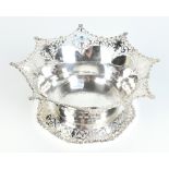 COOPER BROS & SONS LTD; a George V hallmarked silver bowl with pierced rims and a cast floral