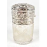 A late 19th century French silver mounted clear etched glass vanity jar, the mount with repoussé