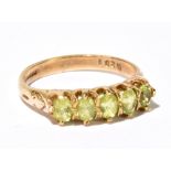 A 9ct yellow gold and green peridot set ring, size O, approx 3.3g.Additional InformationMinor