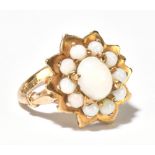 A 9ct yellow gold and opal floral set ring, size M, approx 4.6g.Additional InformationThe ring has