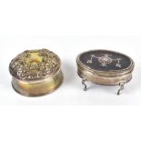 WILLIAM COMYNS & SONS LTD; an Edward VII hallmarked silver dressing table box of oval form with faux