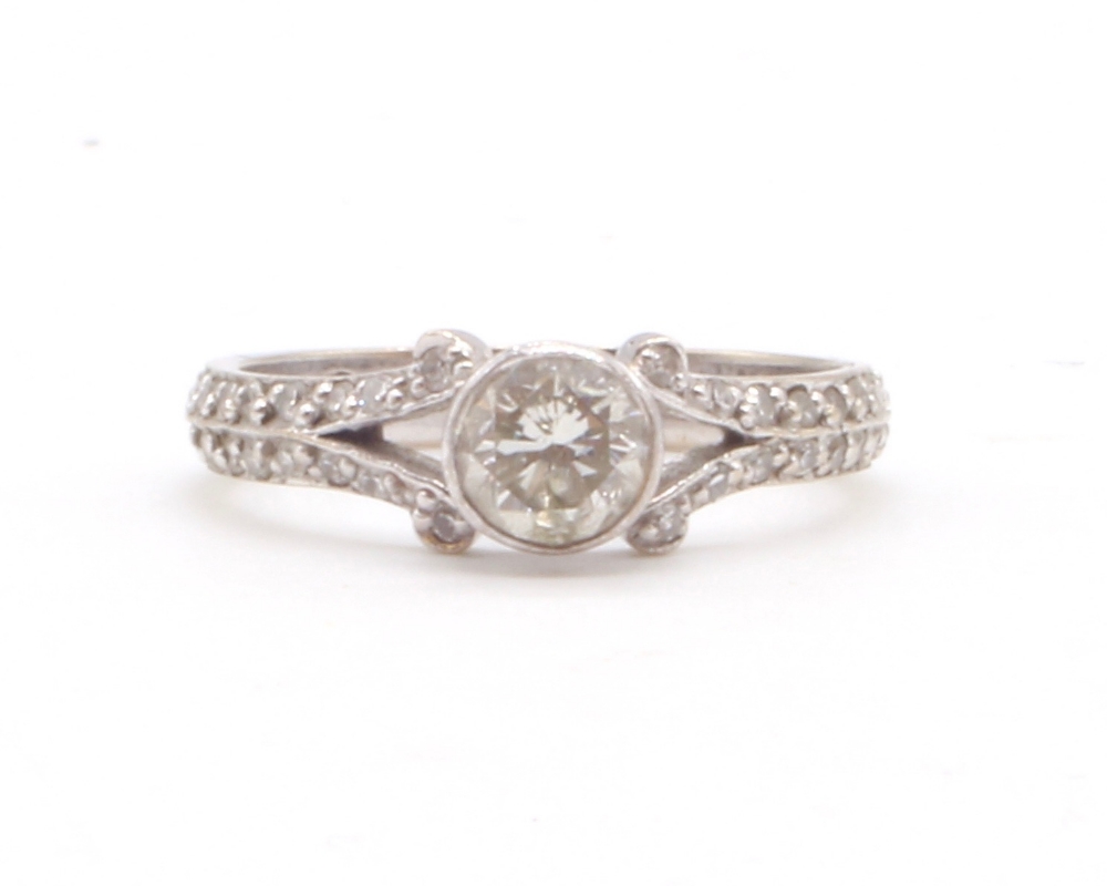 A modern 18ct white gold diamond solitaire ring, the principal collet set stone weighing approx 0. - Image 2 of 4