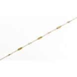 A fine 9ct yellow gold and seed pearl bracelet, length 20cm, approx 1.2g.Additional