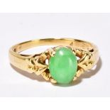 An 18ct yellow gold and cabochon jade set ring, size G 1/2, approx 2.2g. Additional