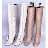 STELLA MCCARTNEY; a pair of cream leather knee-high zip boots (size 38.5 EU) and a pair of snake-