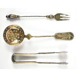 An early 20th century cased set of Russian 84 zolotnik silver sugar strainer, length 14cm, pair of