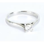 A platinum and diamond solitaire ring, the round brilliant cut stone weighing approx 0.30ct, size