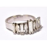 A white metal and diamond ring with five rectangular cut diamonds and four marquise cut diamonds