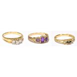 A 9ct yellow gold three stone amethyst ring, a yellow metal rope twist sapphire and melee diamond