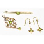 A 15ct yellow gold peridot bar brooch, length 5.5cm, approx 3.1g, a pair of yellow metal peridot and