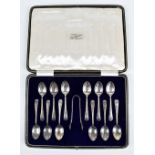 COOPER BROS & SONS LTD; a cased set of twelve George V hallmarked silver teaspoons and matching
