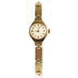 TISSOT; a lady’s 9ct yellow gold mechanical cocktail bracelet watch, the circular dial set with