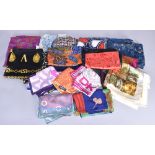 A quantity of silk and other scarves including a Liberty scarf, a Versace scarf and two DKNY