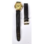 MAJEX; a gentleman's vintage 9ct yellow gold wristwatch with circular dial set with Arabic numerals,