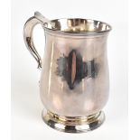 JOHN LANGLANDS I; a good and large George II hallmarked silver mug with scroll loop handle, baluster