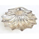 HENRY ATKIN; a Victorian hallmarked silver scallop moulded bowl with repousse foliate detail on