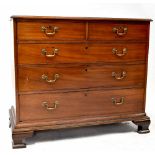 A George III mahogany chest of two short over three long graduated drawers with brass drop swan