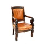 A 19th century rosewood open arm library chair with foliate and Athenian carved top rail,