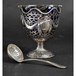 An Elkington & Co hallmarked silver footed sugar bowl with pierced swag and shield decoration to
